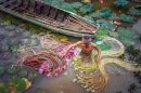 Vietnamesischer Mann pflückt rosa Lotus