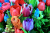 Frühlingsstrauß mit Ranunkeln, Tulpen und Anemonen in leuchtenden Farben