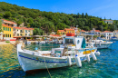 Kioni Port, Ithaka Island, Greece - Sep 19, 2014: Traditional Greek Fishing Boat In Port of Kioni Village. Colorful Boats Are Sy