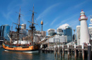 Modern Cityscape With Historic Ship and Lighthouse With Blue Sky In Sydney