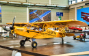 Yellow Piper J3 Cub in Friedrichshafen, Deutschland