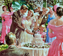 Paar schneidet eine Hochzeitstorte an