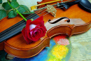 Komposition mit einer Violine und einer roten Rose